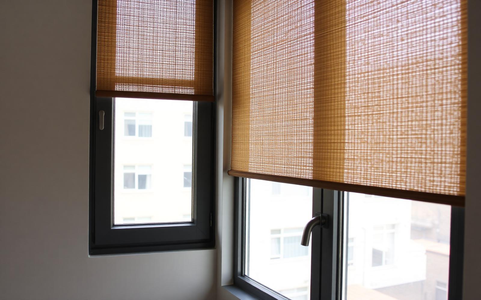 Zebra shades with alternating sheer and solid bands on an apartment window